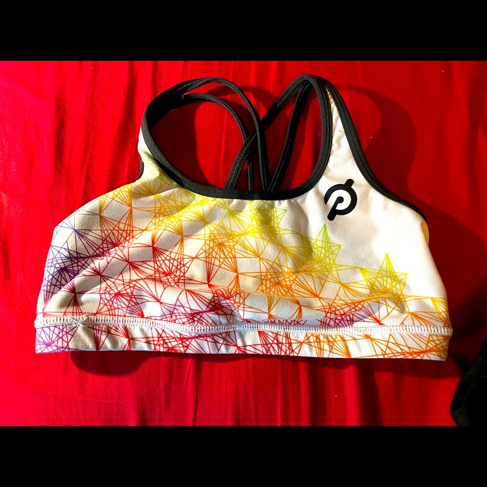 Peloton With brand Pride sports bra.